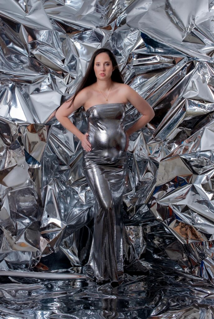 Expecting Mom in the DMV maternity photoshoot on a Beyonce inspired chrome backdrop.