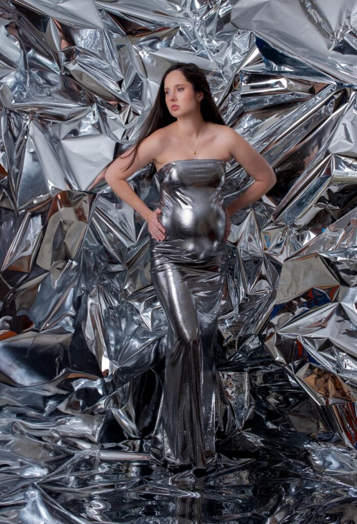 Expecting Mom in the DMV maternity photoshoot on a Beyonce inspired chrome backdrop.