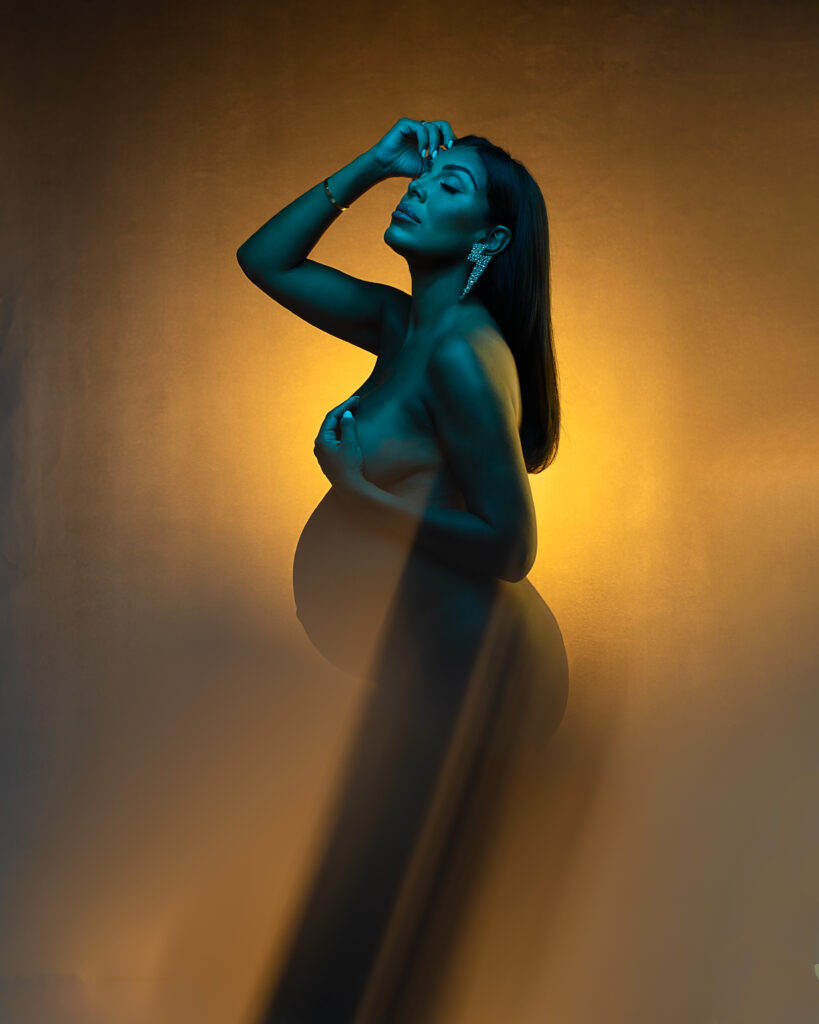 Snapzbytie Photography - Maryland Maternity Photographer - Color Gel Nude Pregnant Photoshoot - Nude Mom Draped in Color Green and Yellow Highlights